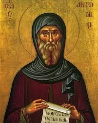An icon of St. Anthony the Great holding a scroll.
