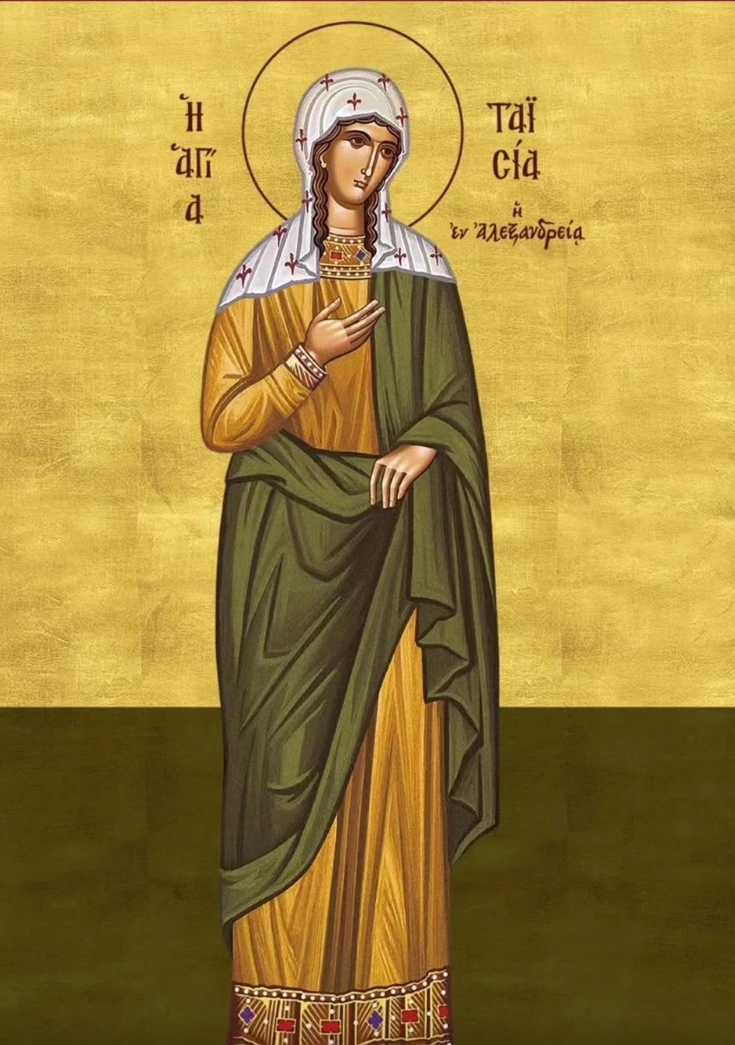 An icon of St. Thais with her hand raised.